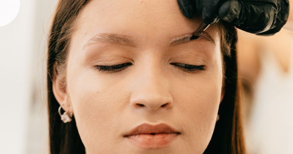 Woman having a brow treatment at a beauty salon in Dubai